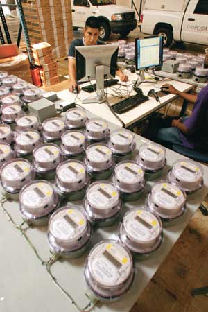 Building the New Electric Grid - Technician programming electric meters