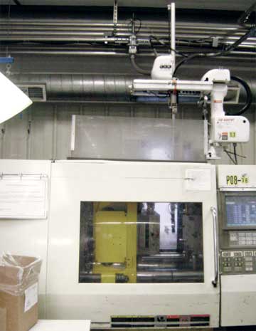 Hands Around the Job - This sprue picker automates scrap handling