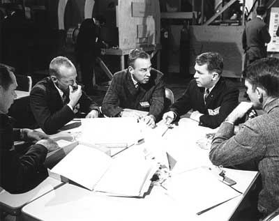 Apollo Mission - Astronauts conferring with Grumman engineers
