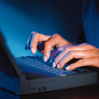 Typing On Laptop In Profile