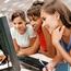 Female Students Looking At Computer Screen