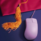 Graduation Tassle Next to Computer Mouse