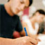 Blurred Male Student Writing