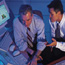 Two Business Men Working At Computer