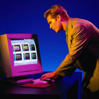 Business Man Looking at Computer Monitor