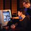 Business Man and Woman Looking At Monitor