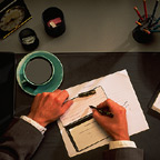 Writing Check On Desk