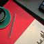 Open Red Folder On Desk