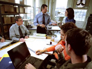 Group Working On Problem Around Table
