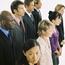 Two Rows Of People Divided By Gender With One Looking Different Direction