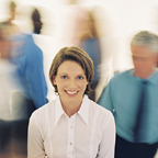 Smiling Woman In Rushing Crowd