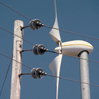 Powerline In Front Of Wind Turbine