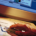 Hand Using Mouse On Desk