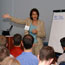 YEF Speaker Pointing At Presentation