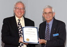 History & Heritage Chair Michael Hunt And John Anderson Holding The 2005 Engineer-Historian Award