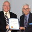 History & Heritage Chair Michael Hunt And John Anderson Holding The 2005 Engineer-Historian Award